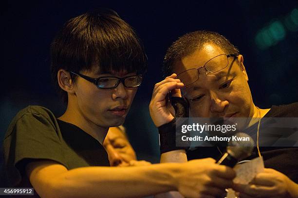 Student activist group Scholarism convenor Joshua Wong and Co-founder of Occupy Central of Love and Peace Benny Tai at a rally ouside of Hong Kong...