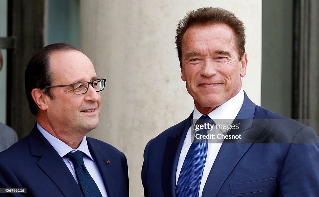 French President Francois Hollande Receives Arnold Schwarzenegger At Elysee Palace In Paris