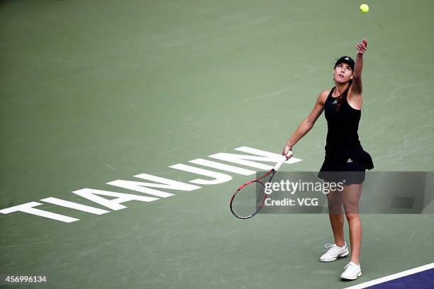 Sorana Cirstea of Romania serves in the quarter-final match against Zheng Saisai of China during day five of Tianjin Open at Tianjin Tuanbo...