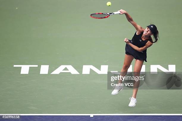 Sorana Cirstea of Romania serves in the quarter-final match against Zheng Saisai of China during day five of Tianjin Open at Tianjin Tuanbo...