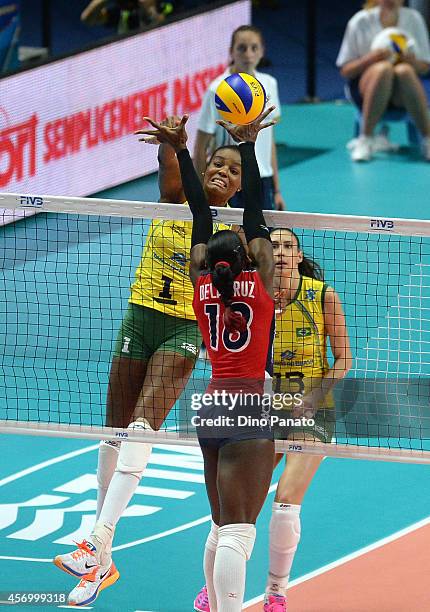 Fabiana Claudino of Brazil spikes the ball against Bethania De La Cruz De Pena of Dominican Republic during the FIVB Women's World Championship pool...