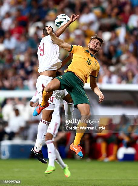 James Holland of Australia and Ismail Ahmed Ismail Mohammed of the U.A.E. Challnge for the ball durng the international friendly between the UAE and...