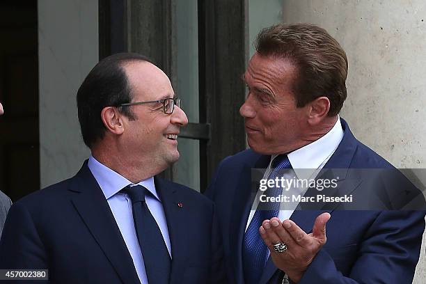 French President Francois Hollande receives Arnold Schwarzenegger at Elysee Palace on October 10, 2014 in Paris, France.