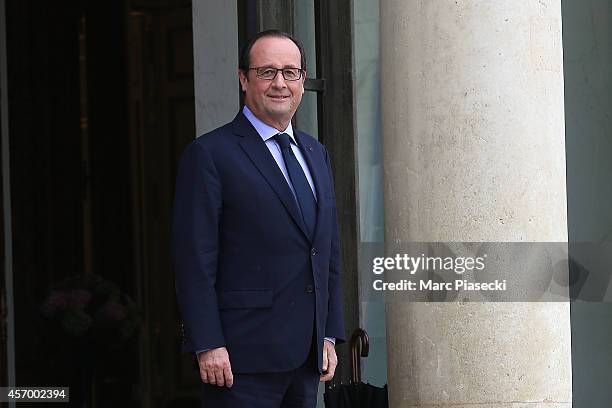 French President Francois Hollande receives Arnold Schwarzenegger at Elysee Palace on October 10, 2014 in Paris, France.