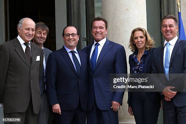 French President Francois Hollande receives Arnold Schwarzenegger at Elysee Palace on October 10, 2014 in Paris, France.