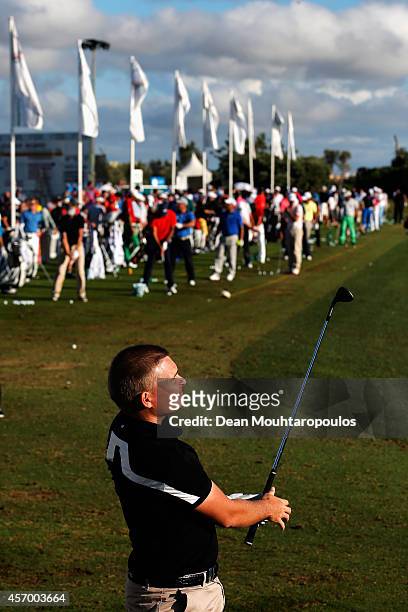 James Morrison of England hits a practice shot on the driving range during Day 2 of the Portugal Masters held at the Oceanico Victoria Golf Course on...