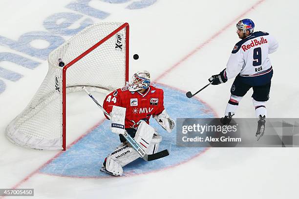 Goalkeeper Dennis Endras of Mannheim saves a penalty from Garrett Roe of Muenchen during the DEL match between Adler Mannheim and EHC Red Bull...