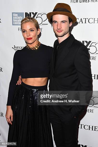 Actors Sienna Miller and Tom Sturridge attend the "Foxcatcher" premiere during the 52nd New York Film Festival at Alice Tully Hall on October 10,...