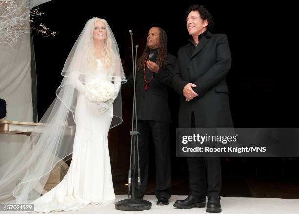 Reverend Michael Beckwith officiates the wedding of Michaele Schon and Neal Schon at the Palace of Fine Arts on December 15, 2013 in San Francisco,...