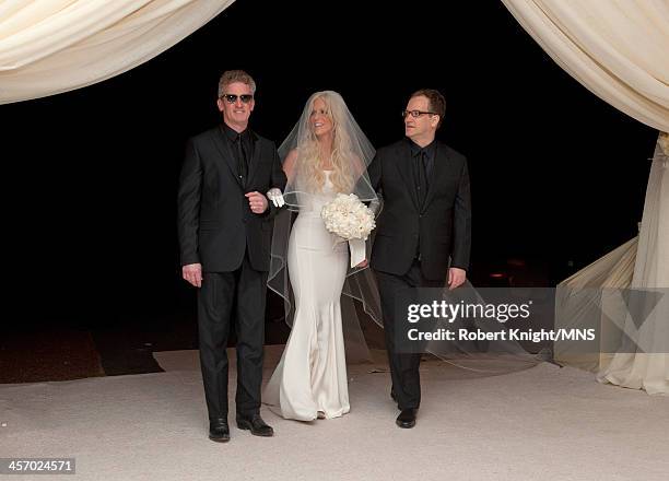 Howard Holt and Glen Holt walk their sister Michaele Schon down the aisle at her wedding to Neal Schon at the Palace of Fine Arts on December 15,...
