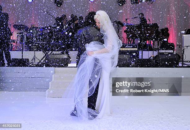 Michaele Schon and Neal Schon attend their wedding at the Palace of Fine Arts on December 15, 2013 in San Francisco, California.