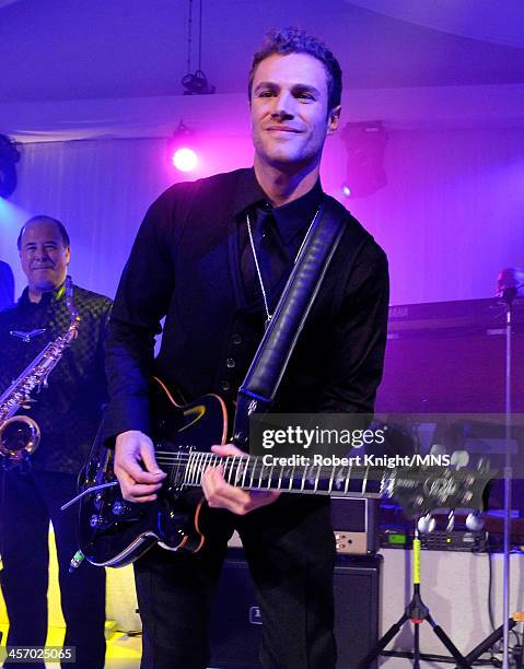 Miles Schon performs at the wedding of Michaele Schon and Neal Schon at the Palace of Fine Arts on December 15, 2013 in San Francisco, California.