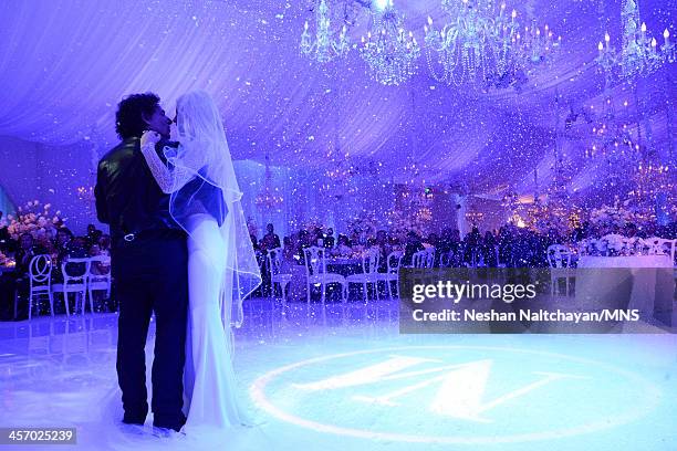 Michaele Schon and Neal Schon attend their wedding at the Palace of Fine Arts on December 15, 2013 in San Francisco, California.