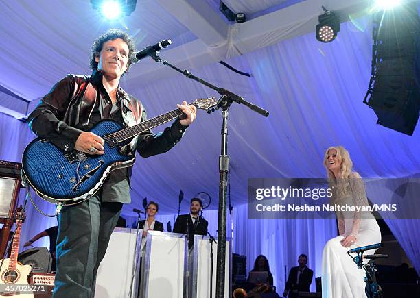 Neal Schon performs for Michaele Schon during their wedding at the Palace of Fine Arts on December 15, 2013 in San Francisco, California.