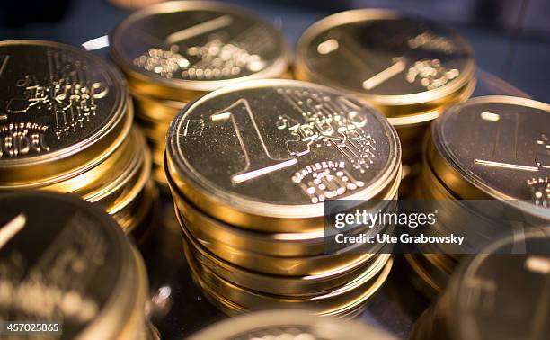 Piles of chocolate one euro coins in gold foil as seen on November 12, 2013 in Brussels, Belgium.