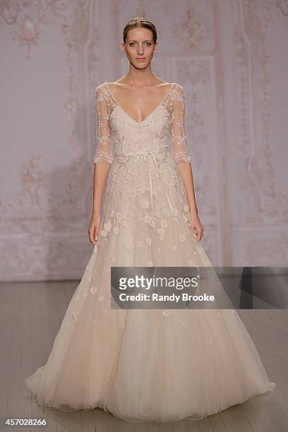 Model walks the runway during the Fall 2015 Monique Lhuillier Bridal Show on October 10, 2014 in New York City.