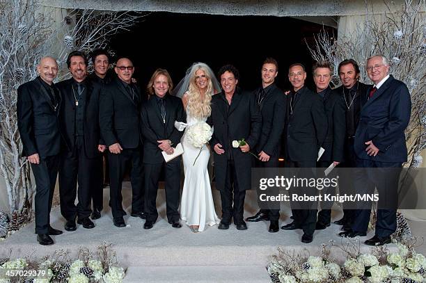 Michaele Schon and Neal Schon pose with the groomsmen, including Miles Schon , Mike Carabello , Ross Valory , and Jonathan Cain at their wedding at...