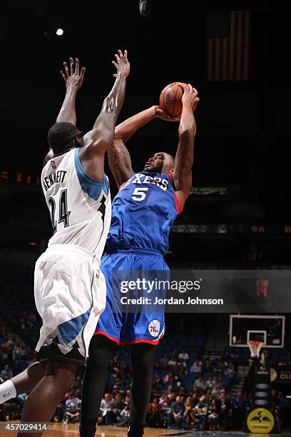 Arnett Moultrie of the Philadelphia 76ers shoots as Anthony Bennett of the Minnesota Timberwolves defends the basket during the game on October 10,...