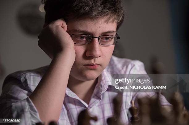 Thirteen year-old chess player Samuel Sevian plays against his father Armen Sevian in Alexandria, Virginia, on October 9, 2014. Sevian is on course...