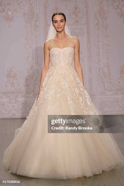 Model walks the runway during the Fall 2015 Monique Lhuillier Bridal Show on October 10, 2014 in New York City.