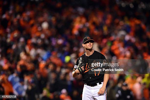 Brian Matusz of the Baltimore Orioles reacts after Mike Moustakas of the Kansas City Royals hit a two run home run to right center field in the tenth...