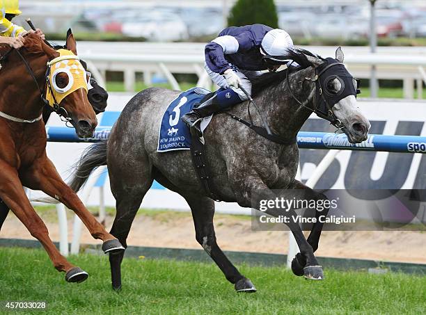 Nicholas Hall riding Fawkner defeats Hugh Bowman riding Criterion in Race 6, the Cathay Pacific Caulfield Stakes during Caulfield Guineas Day at...