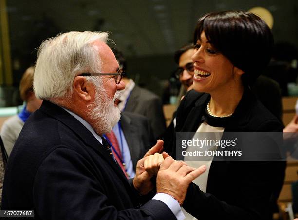 Spanish Agriculture minister Miguel Arias Canete talks with Italian counterpart Nunzia De Girolamo before an Agriculture Council meeting at the EU...