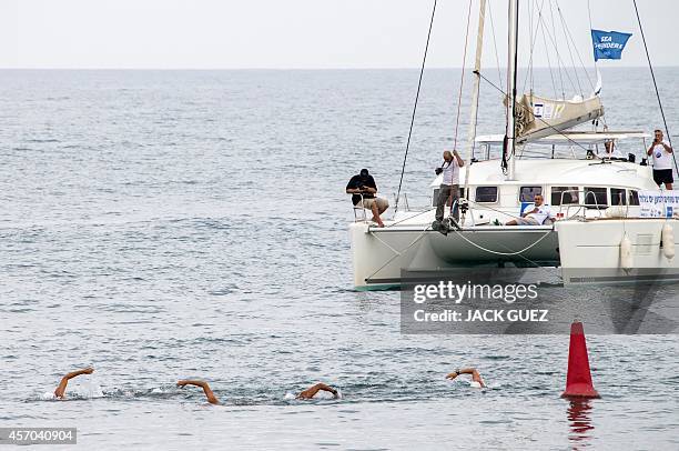 Israeli swimmers arrive at the Marina in the Israeli coastal city of Herzliya after swimming in turns 400 kms from the Mediterranean island of Cyprus...