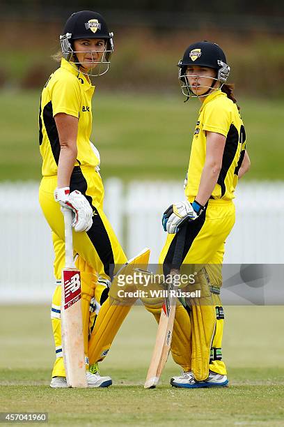Charlotte Edwards and Chloe Piparo of The Western Fury check the field of play during the WNCL match between Western Australia and Queensland at...