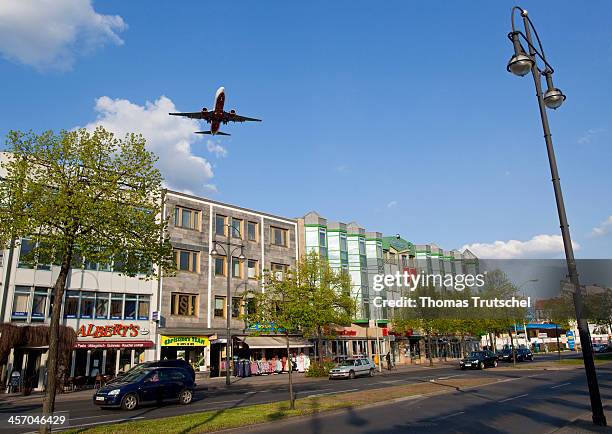 An airplane flying over the Kurt-Schumacher-Platz on it's approach to Berlin Tegel Airport on April 25 in Berlin, Germany. Berlin Tegel Otto...