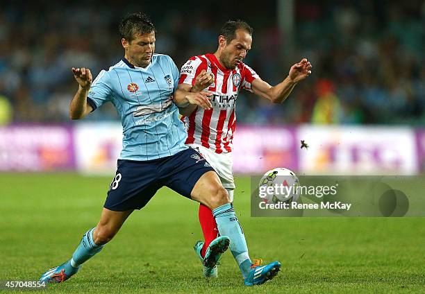 Milos Dimitrijevic of Sydney FC and Massimo Murdocca of Melbourne City compete for the ball during the round one A-League match between Sydney FC and...