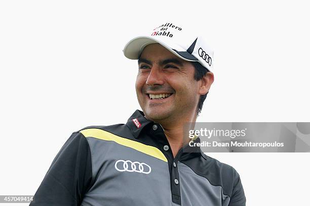 Felipe Aguilar of Chile smiles after he hits his tee shot on the 1st hole during Day 3 of the Portugal Masters held at the Oceanico Victoria Golf...