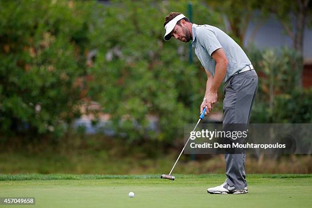 Scott Jamieson of Scotland putts on the 8th green during Day 3 of the Portugal Masters held at the Oceanico Victoria Golf Course on October 11, 2014...