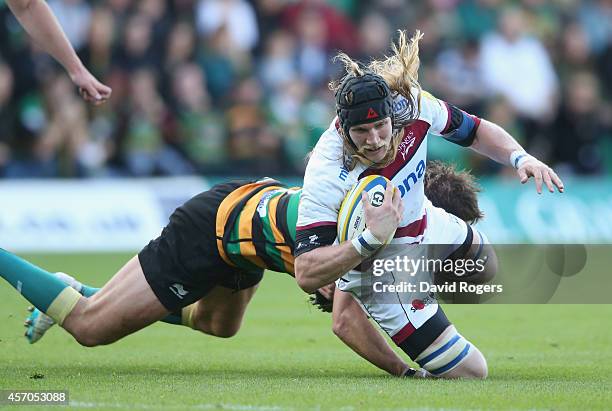 Magnus Lund of Sale is tackled by Jon Fisher during the Aviva Premiership match between Northampton Saints and Sale Sharks at Franklin's Gardens on...