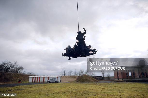 French National Gendarmerie Intervention Group members participate in a training session at the Mondesir base on January 10, 2011 near Etampes, west...