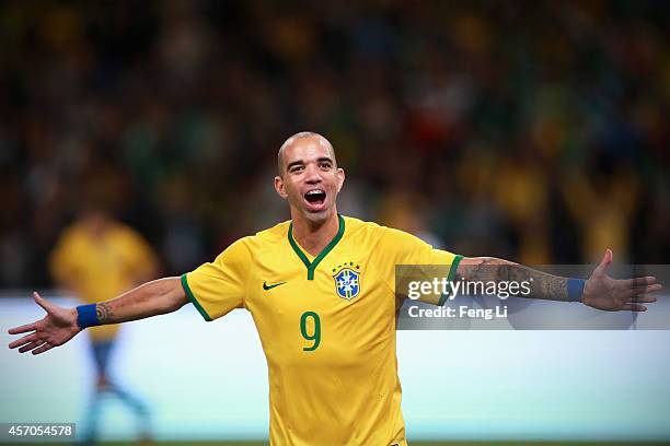 Diego Tardelli of Brazil celebrates after scoring the second goal during Super Clasico de las Americas between Argentina and Brazil at Beijing...