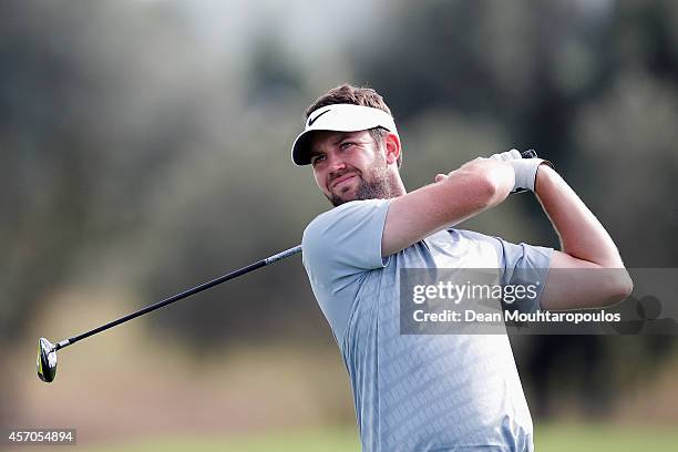 Scott Jamieson of Scotland hits his second shot on the 17th hole during Day 3 of the Portugal Masters held at the Oceanico Victoria Golf Course on...