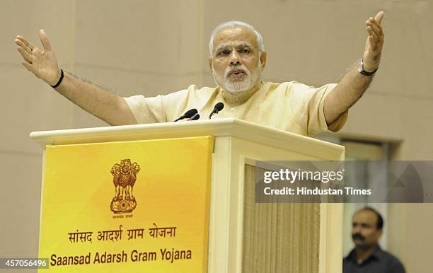 Prime Minister Narendra Modi addresses during the launch of Saansad Adarsh Gram Yojana , on October 11, 2014 in New Delhi, India. Modi launched an...