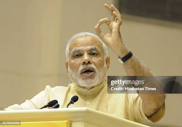 Prime Minister Narendra Modi addresses during the launch of Saansad Adarsh Gram Yojana , on October 11, 2014 in New Delhi, India. Modi launched an...