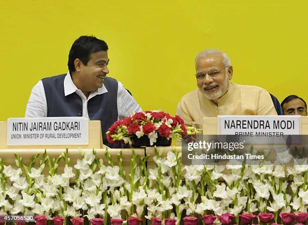 Prime Minister Narendra Modi along with Union Minister for Rural Development Nitin Gadkari during the launch of Saansad Adarsh Gram Yojana , on...