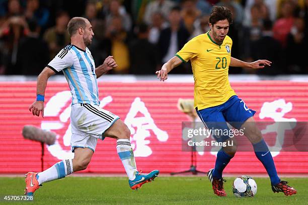 Kaka of Brazil competes the ball with Zabaleta of Argentina during Super Clasico de las Americas between Argentina and Brazil at Beijing National...