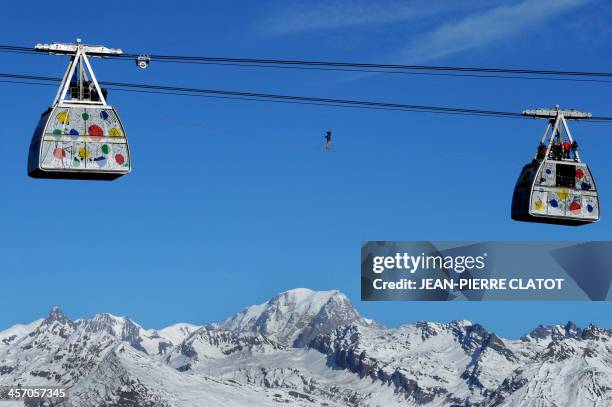 French highliner Tancrede Melet performs on the Paradiski cable way, 380m high, designed by French creator Jean-Charles de Castelbajac, on December...