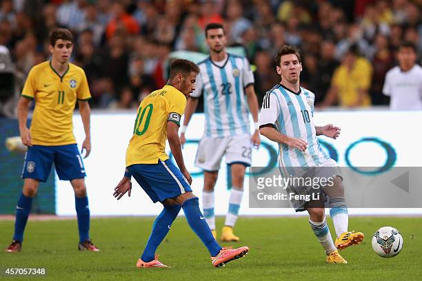 Neymar of Brazil competes the ball with Lionel Messi of Argentina during Super Clasico de las Americas between Argentina and Brazil at Beijing...
