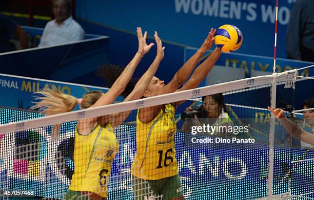 Thaisa Menezes and Fernanda Rodrigues of Brazil triest to save a spike against during the FIVB Women's World Championship semi-final match between...