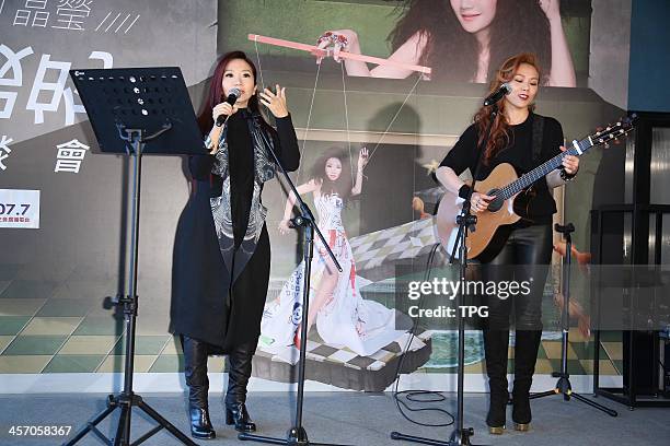 Momoco Tao promotes her new album on Sunday December 15,2013 in Taipei,China.Tanya Chua presents to support.