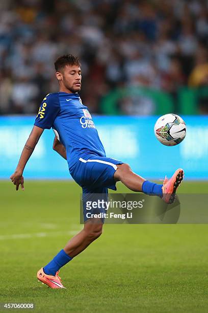 Neymar of Brazil warms up before Super Clasico de las Americas between Argentina and Brazil at Beijing National Stadium on October 11, 2014 in...