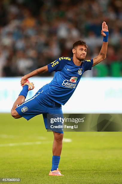 Neymar of Brazil warms up before Super Clasico de las Americas between Argentina and Brazil at Beijing National Stadium on October 11, 2014 in...