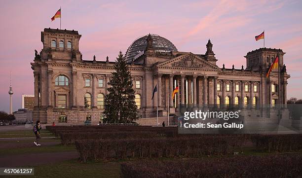 The Reichstag, seat of the Bundestag, stands under a twilight sky on the day Angela Merkel, Chancellor and Chairwoman of the German Christian...