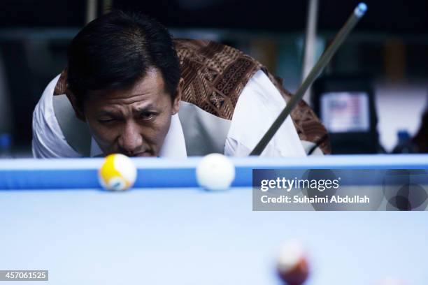 Ricky Yang of Indonesia competes in the 9 Ball Pool Men Final at the Wunna Theikdi Billiards Hall during the the 2013 Southeast Asian Games on...