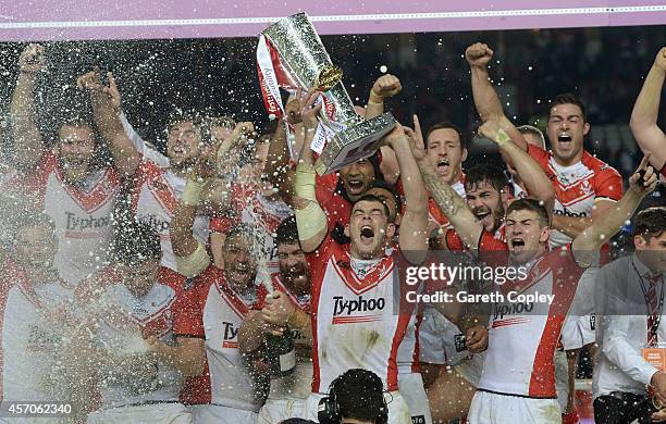 St Helens captain Paul Wellens lifts the trophy after winning the First Utility Super League Grand Final between St Helens and Wigan Warriors at Old...